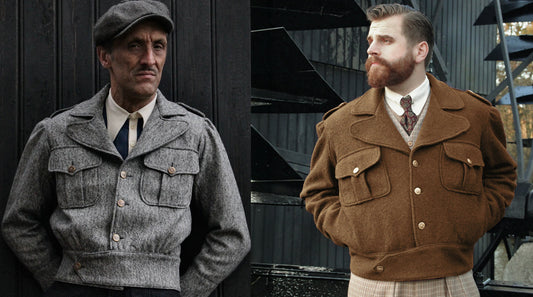 Two men wearing cropped, vintage-inspired Ike-style jackets. One jacket is grey wool and the other brown wool, both featuring chest pockets, a defined waistband, and a military-inspired silhouette.