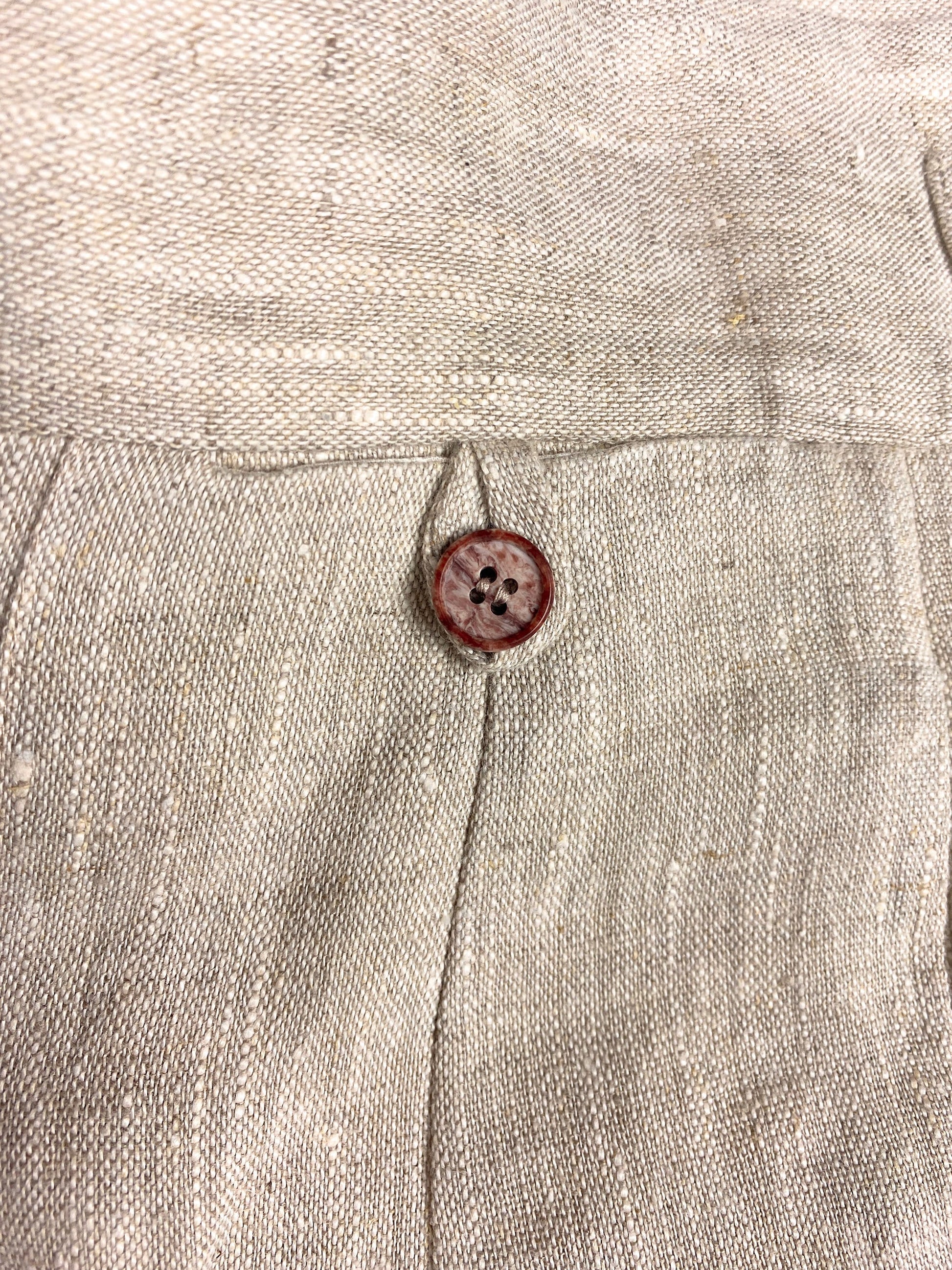 1930s style ladies suit pants for women in natural colored linen. These trousers are adapted from a 1930s mens pattern with wide fit, pleated front, very high waisted, fishtail back and buckle back. close up of the watch pocket