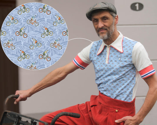 Vintage-inspired men's cycling polo shirt with blue bicycle print and red high-waisted trousers